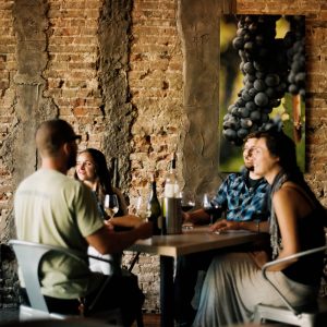 Friends laughing at restaurant in Bloomington, Indiana
